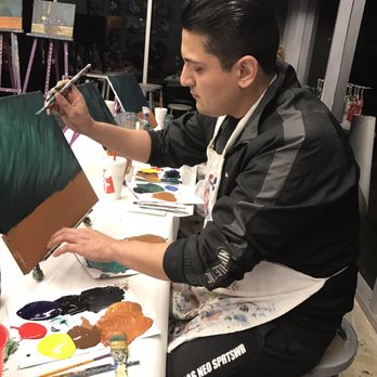 Purple Easel - Hubby hard at work! He's a great artist! - Paint & Sip Near Me - Ontario, California Purple Easel - Hubby hard at work! He's a great artist! - Paint & Sip Near Me - Ontario, California