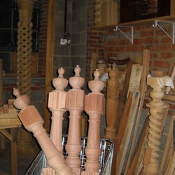 MWT Custom Woodwork - Turning Newel Post with Finial on Top with Column Hollow Spiral in Background