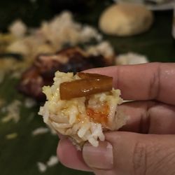Perla - One of many bites enjoyed while eating with hands. This was pork on garlic rice w vinegar dipping sauce. Yum!