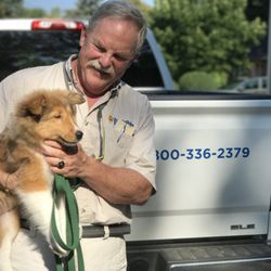Invisible Fence Brand Of Apple - Owner, Smoot Carter, wrapping up a training session with Nick, a Shetland Sheepdog puppy who likes to explore - now he can do so freely!