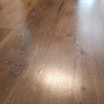 Empire Today - Seams of flooring beaded up from water, again supposed to be water resistant. - Carpet Installation Near Me Empire Today - Seams of flooring beaded up from water, again supposed to be water resistant. - Carpet Installation Near Me