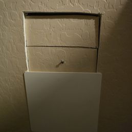 Cutout in closet to get to shower valve that is supposed to be covered up by access panel. Cutout in closet to get to shower valve that is supposed to be covered up by access panel.