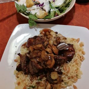 Photo of Sizzler - San Diego, CA, United States. Sirloin Tips dwarfed by salad.