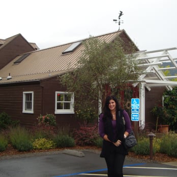 Truett Hurst - Lisa in front of the tasting room at Truett Hurst - Wine Tasting Room Near Me - Healdsburg, California Truett Hurst - Lisa in front of the tasting room at Truett Hurst - Wine Tasting Room Near Me - Healdsburg, California