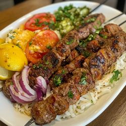 Milano Kabob - Our chef selects the finest cuts of lamb leg, which are trimmed and hand-cut into perfect cubes, Each skewer is grilled to achieve a tender
