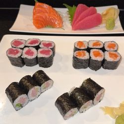 Samurai Japanese Hibachi Steakhouse - Three roll lunch special, salmon sashimi, and tuna sashimi.