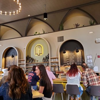 Bell Tower Brewing - a group of people sitting at tables - Brewpubs Near Me - Kent, Ohio Bell Tower Brewing - a group of people sitting at tables - Brewpubs Near Me - Kent, Ohio