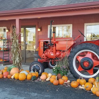 Chase Farms - a tractor and pumpkins in front of a store - Fruits & Veggies Near Me - Wells, Maine Chase Farms - a tractor and pumpkins in front of a store - Fruits & Veggies Near Me - Wells, Maine