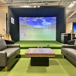 GolfersBZ - Couches and tables at every bay! Kick back while you enjoy some golf with your friends and family!