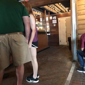 Moo's Barn And Grill - a man and a woman sitting on a bench - Burgers Near Me - Natchez, Mississippi