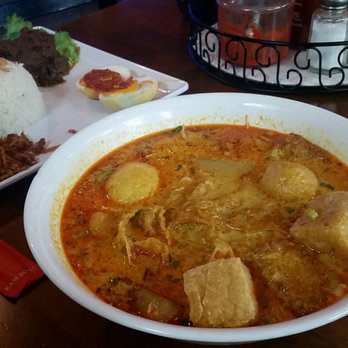 Sky Cafe - Curry soup with rice noodles in the front; beef rendang in the back - Indonesian Near Me - Philadelphia, Pennsylvania Sky Cafe - Curry soup with rice noodles in the front; beef rendang in the back - Indonesian Near Me - Philadelphia, Pennsylvania