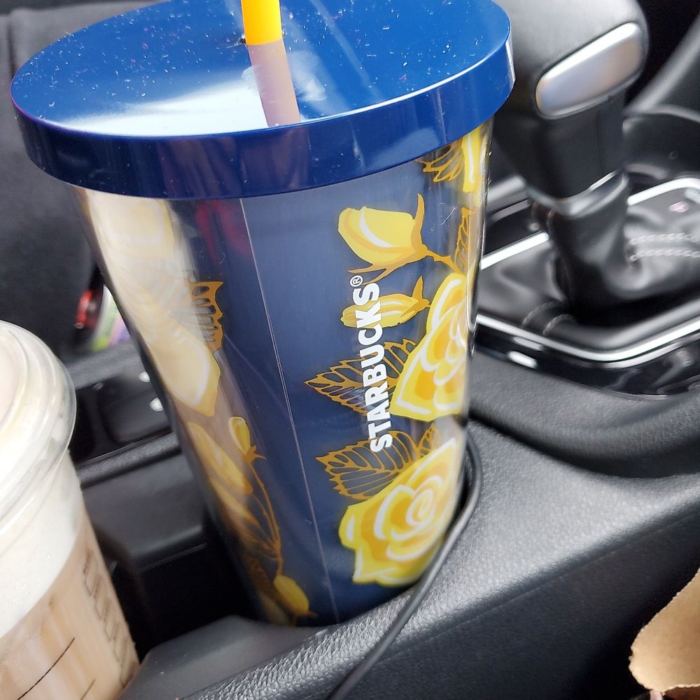 a cup with a straw in it a cup with a straw in it
