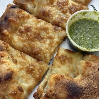 Nomads Pizza - Cheese bread w/ garlic pesto sauce - Food Trucks Near Me - Prineville, Oregon Nomads Pizza - Cheese bread w/ garlic pesto sauce - Food Trucks Near Me - Prineville, Oregon