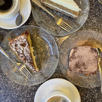 Caffe Greco - Carrot cake (top), tiramisu (right), sacripantina (left) with hot americanos - Coffee & Tea Near Me - San Francisco, California