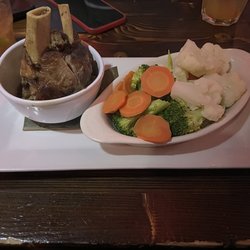 Mamajuana Restaurant & Lounge - Lechón Asado with steamed veggies