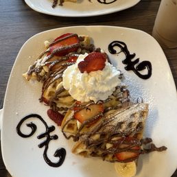 Waffle with Nutella/strawberries/bananas/whipped cream! It was amazing!! Waffle with Nutella/strawberries/bananas/whipped cream! It was amazing!!