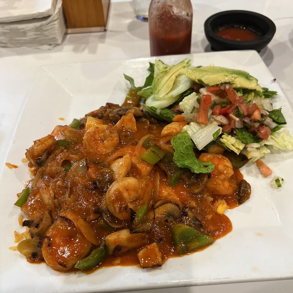 Mariscos Tulense  Scallops and shrimp with a cheesy rice sauce