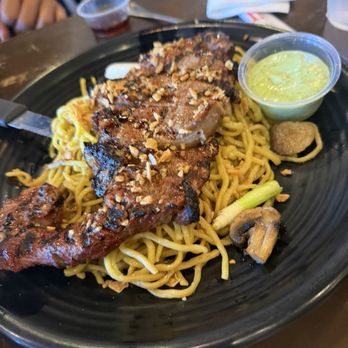 OMELI Kitchen - Rib Eye Garlic noodles are pre packaged yaki-soba noodles. The green sauce is not traditional Peruvian. It's just mayo and cilantro. - Vietnamese Near Me - Fullerton, California
