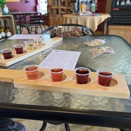 a flight of beers on a table a flight of beers on a table