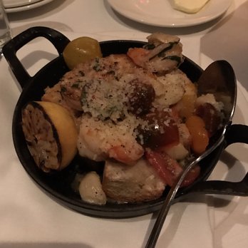 The Capital Grille - Cast iron garlic shrimp appetizer - Steakhouses Near Me - Mclean, Virginia The Capital Grille - Cast iron garlic shrimp appetizer - Steakhouses Near Me - Mclean, Virginia