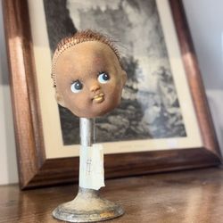 One Eleven - Baby head on a stick