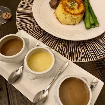 Fraiche Catering - Sliced tenderloin, asparagus, au gratin potatoes, served with a trio of dipping sauces. - Caterers Near Me - San Francisco, California Fraiche Catering - Sliced tenderloin, asparagus, au gratin potatoes, served with a trio of dipping sauces. - Caterers Near Me - San Francisco, California