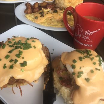 Ruby Slipper Midcity - Peacemaker Benedict's with corned beef hash and blackstone ham, a salmon omelet, pancakes and coffee - Breakfast & Brunch Near Me - New Orleans, Louisiana Ruby Slipper Midcity - Peacemaker Benedict's with corned beef hash and blackstone ham, a salmon omelet, pancakes and coffee - Breakfast & Brunch Near Me - New Orleans, Louisiana