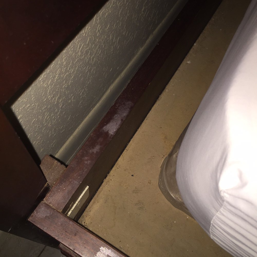 Boca Raton's Boca Inn - Visible dust and dirt on bed - Hotels Near Me - Boca Raton, Florida