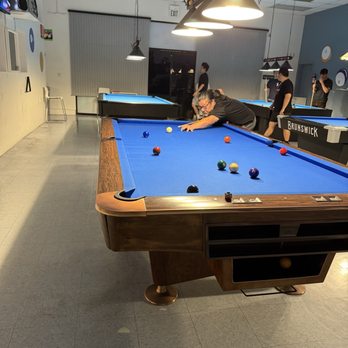 Momentum Billiards - Mr. M hitting balls - Pool Halls Near Me - Oakland, California Momentum Billiards - Mr. M hitting balls - Pool Halls Near Me - Oakland, California