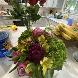 Smaller bouquet in the foreground. Regular roses in the background for reference. Smaller bouquet in the foreground. Regular roses in the background for reference.
