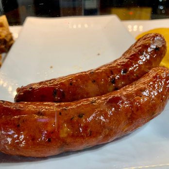 Rancho Mateo - two sausages on a white plate - Steakhouses Near Me - Elizabeth, New Jersey Rancho Mateo - two sausages on a white plate - Steakhouses Near Me - Elizabeth, New Jersey