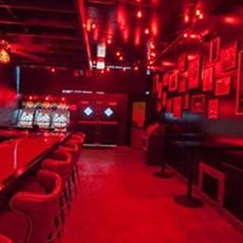 Slippery Slope - a dimly lit bar with red lighting - Dive Bars Near Me - Chicago, Illinois Slippery Slope - a dimly lit bar with red lighting - Dive Bars Near Me - Chicago, Illinois