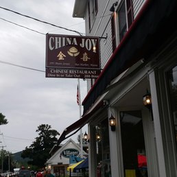 people walking in front of a chinese restaurant