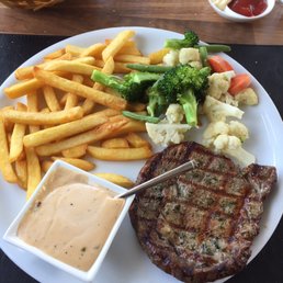 Prime rib steak with peppercorn sauce.