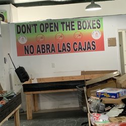 Deal Burners - Signage inside store telling customers not open boxes