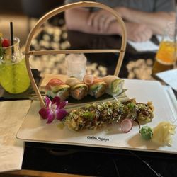 Dynamite roll and rainbow roll. With green bamboo cocktail