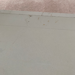 Stains from their equipment they left on the countertop.
