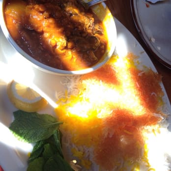 Kabob Hutt - Eggplant, pea lentil, beef stew  with saffron rice over white basmati rice served with a mint leaf on the side. - Persian/Iranian Near Me - Corona, California