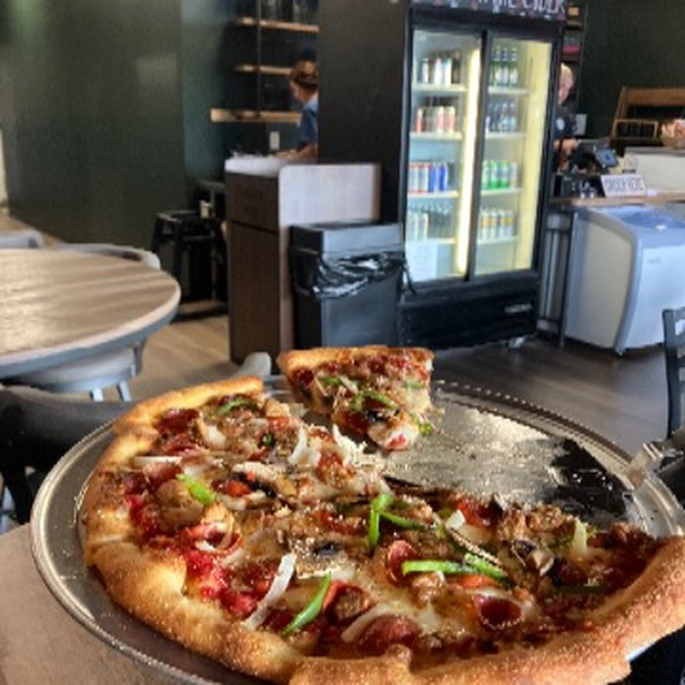 The "Pantry" Pizza. Italian sausage, cup & char pepperoni, green peppers, onions, fresh mushrooms, mozzarella, red sauce base
