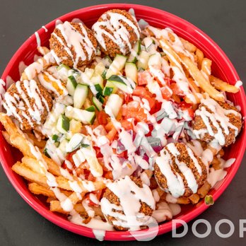 The Meat Revolution - a bowl of fries with sauce drizzled on top - Wraps Near Me - Loveland, Colorado The Meat Revolution - a bowl of fries with sauce drizzled on top - Wraps Near Me - Loveland, Colorado