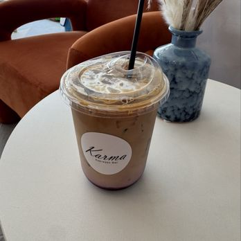 Karma Espresso Bar - Iced latte with dark forest syrup - Coffee & Tea Near Me - San Antonio, Texas