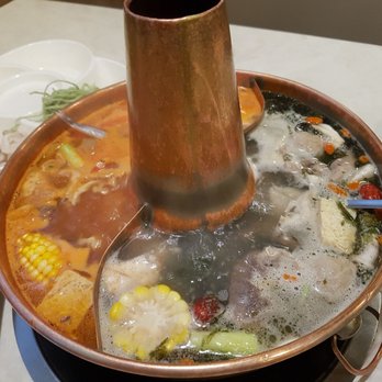 Beijing Hot Pot Restaurant - Water broth and tomato broth in a double pot - Hot Pot Near Me - Toronto, Ontario