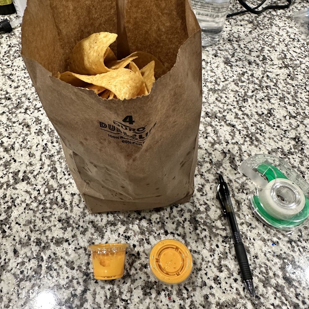 Gimme Taco - Chips and queso to go. This is literally all the queso it came with. Pen & tape for scale. - Tacos Near Me - Aubrey, Texas Gimme Taco - Chips and queso to go. This is literally all the queso it came with. Pen & tape for scale. - Tacos Near Me - Aubrey, Texas