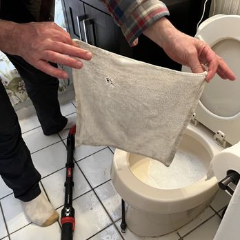 AnyFix - Towel being held up. - Plumbing Near Me