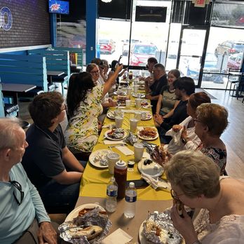 Mediterranean Bistro - A large party eating a variety of gyros and falafel's - Mediterranean Near Me - Kennesaw, Georgia Mediterranean Bistro - A large party eating a variety of gyros and falafel's - Mediterranean Near Me - Kennesaw, Georgia