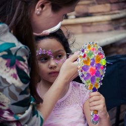 A New Twist Balloons and Face Painting - Flower face painting.