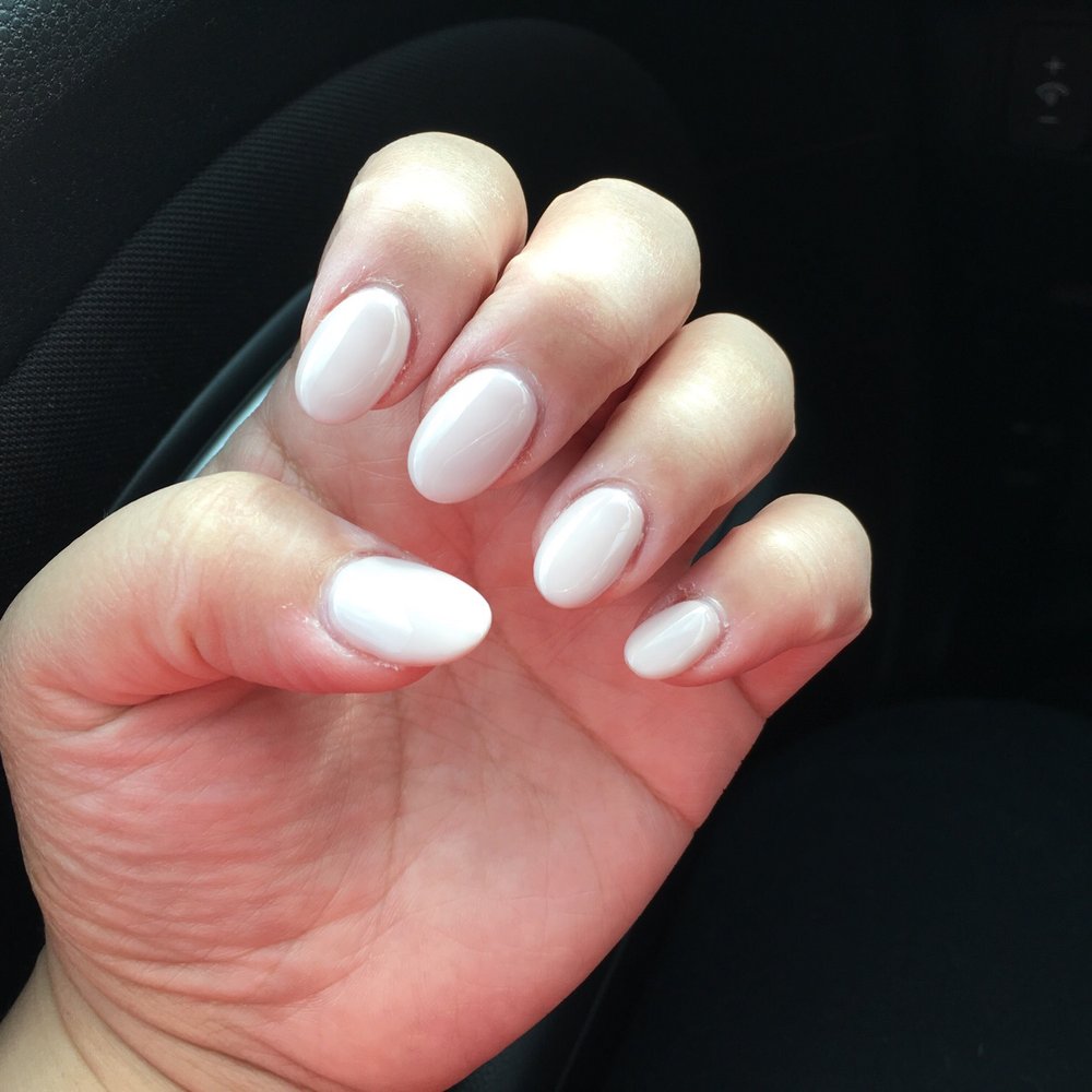 Nails First - Acrylic almond-shaped nails with nude pink gel polish. - Nail Salons Near Me - Knoxville, Tennessee Nails First - Acrylic almond-shaped nails with nude pink gel polish. - Nail Salons Near Me - Knoxville, Tennessee