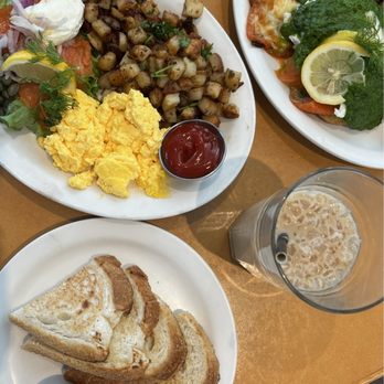 Stella's Plug In - Smoked salmon breakfast with sourdough and Stella's jam (left) and smoked salmon benny (right) - Breakfast & Brunch Near Me - Winnipeg, Manitoba