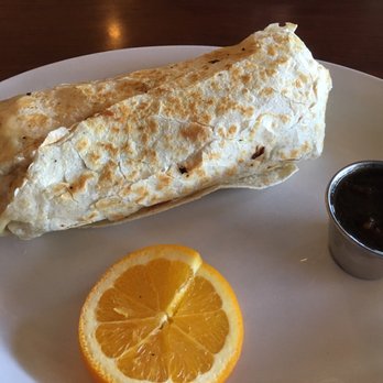 Waypoint Cafe - Breakfast Burrito.  Not very good.  Over cooked bacon, lots of potatoes.  That enchilada sauce on the right is no bueno. - American Near Me - Camarillo, California