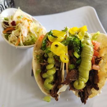 Sunshine Grill - Jerk pork Tacos. Delicious with a spicy kick - New American Near Me - Grand Cayman, Virgin Islands Sunshine Grill - Jerk pork Tacos. Delicious with a spicy kick - New American Near Me - Grand Cayman, Virgin Islands